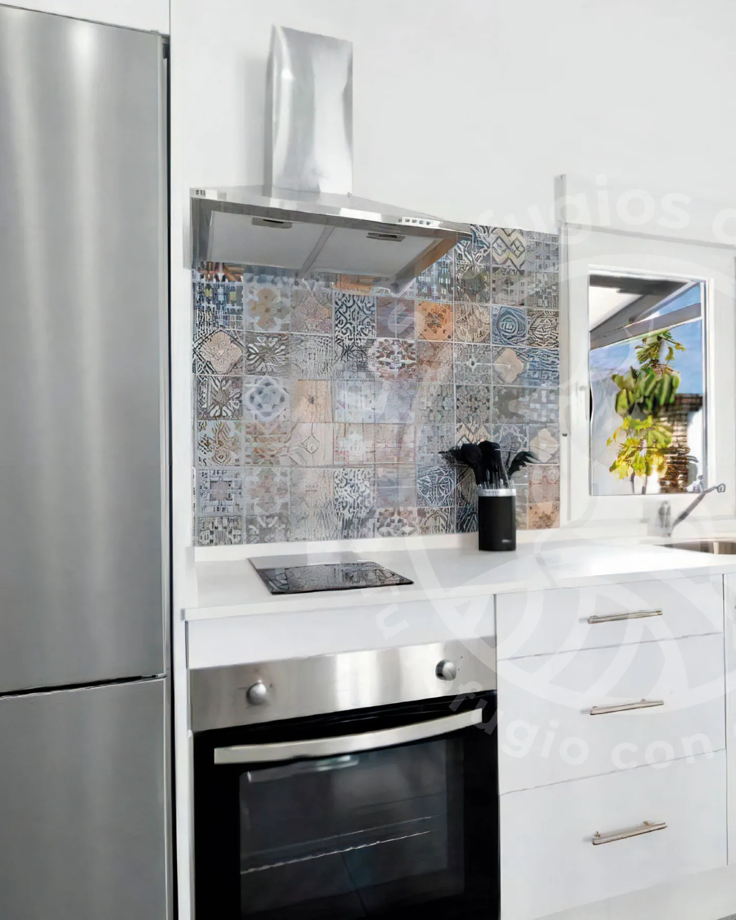 Equipped kitchen with Mediterranean tiles in a house with pool
