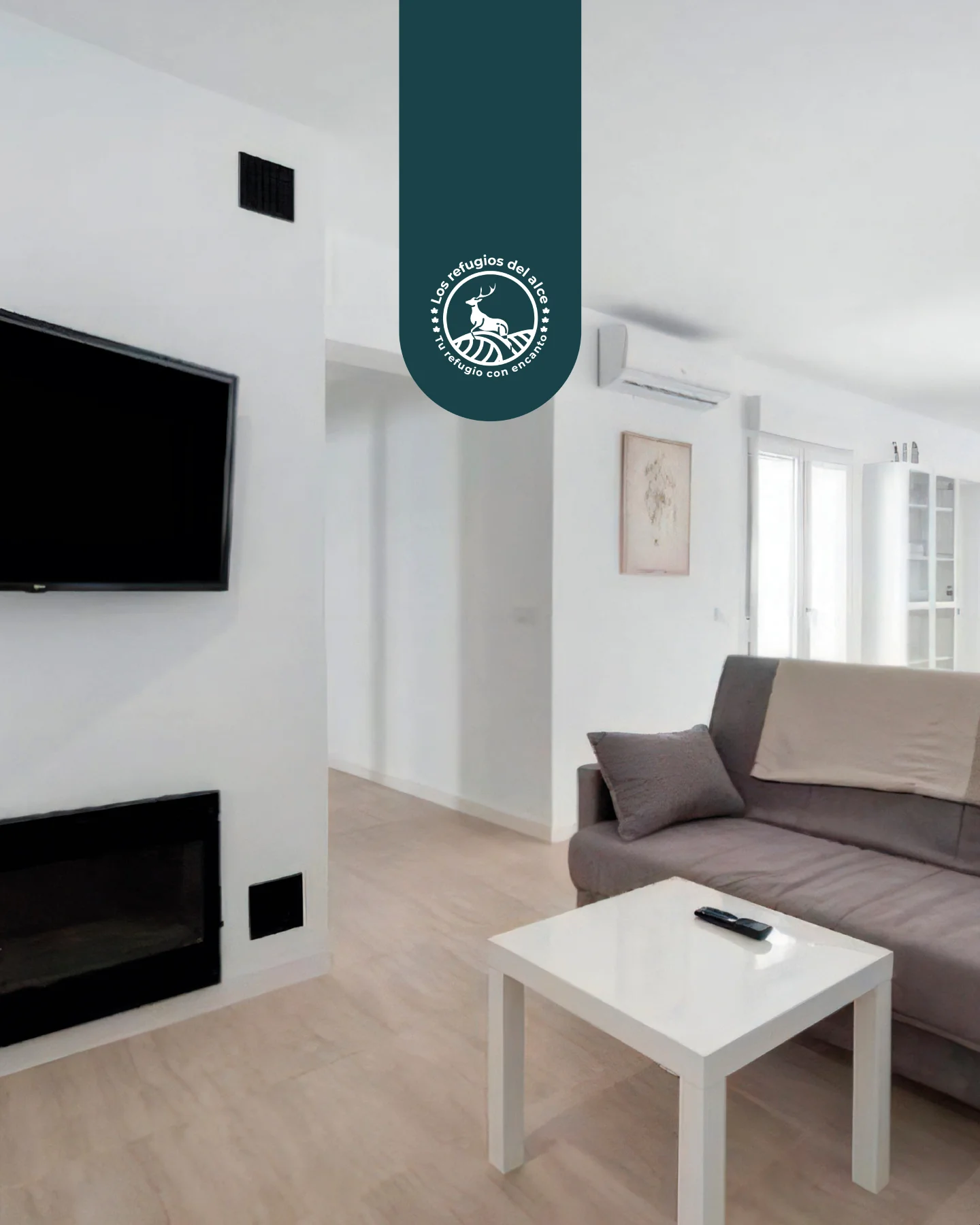 Bright living room of the rural house in Chiclana with a sofa and television
